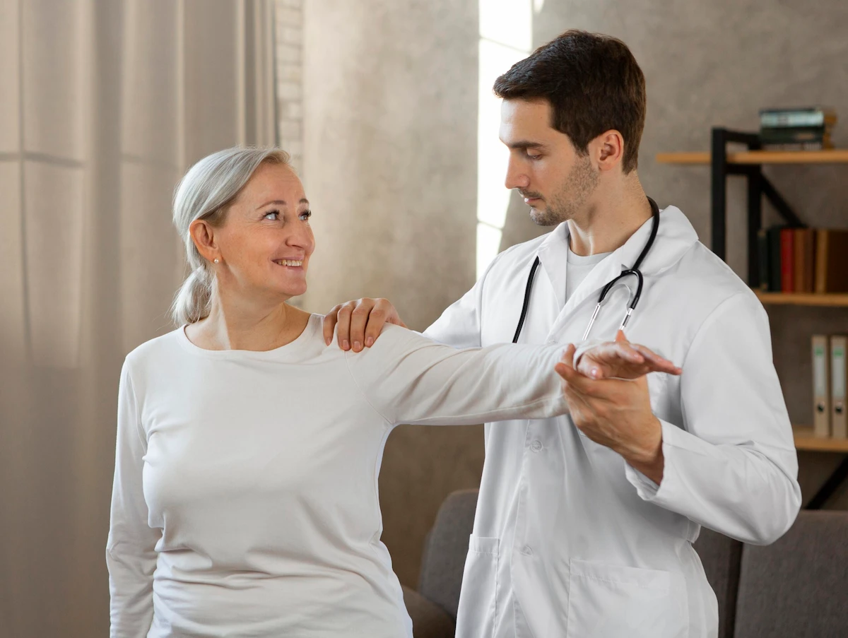 Chiropractor testing shoulder range of motion on a female