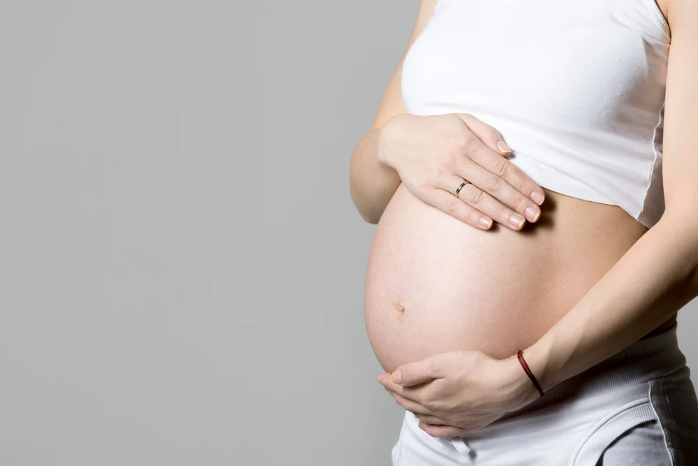 Pregnant woman receiving gentle chiropractic adjustment in Crawfordsville