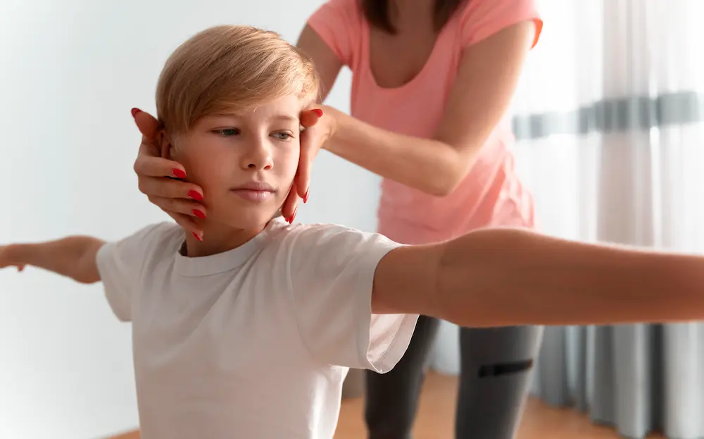 Chiropractor providing gentle spinal care for child to support posture and healthy development