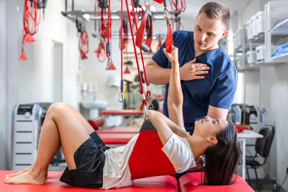 Chiropractor assessing patient during treatment session