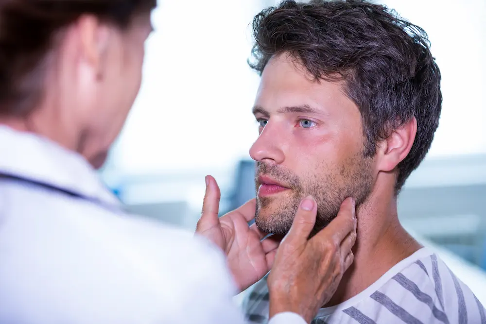Chiropractor treating TMJ disorder to relieve jaw pain and improve function