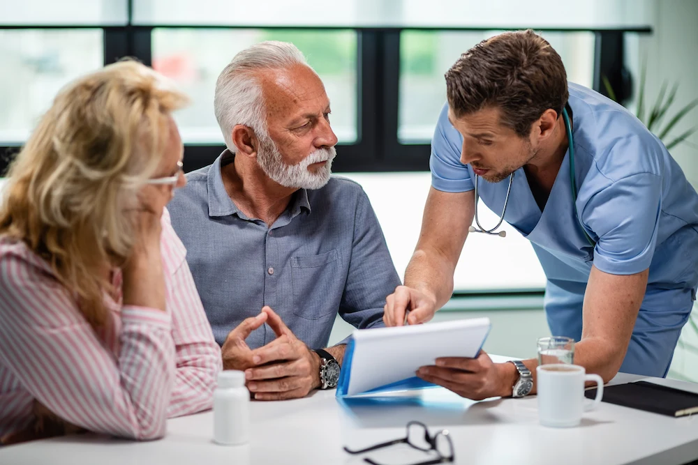 Primary care provider consulting with a patient about their health
